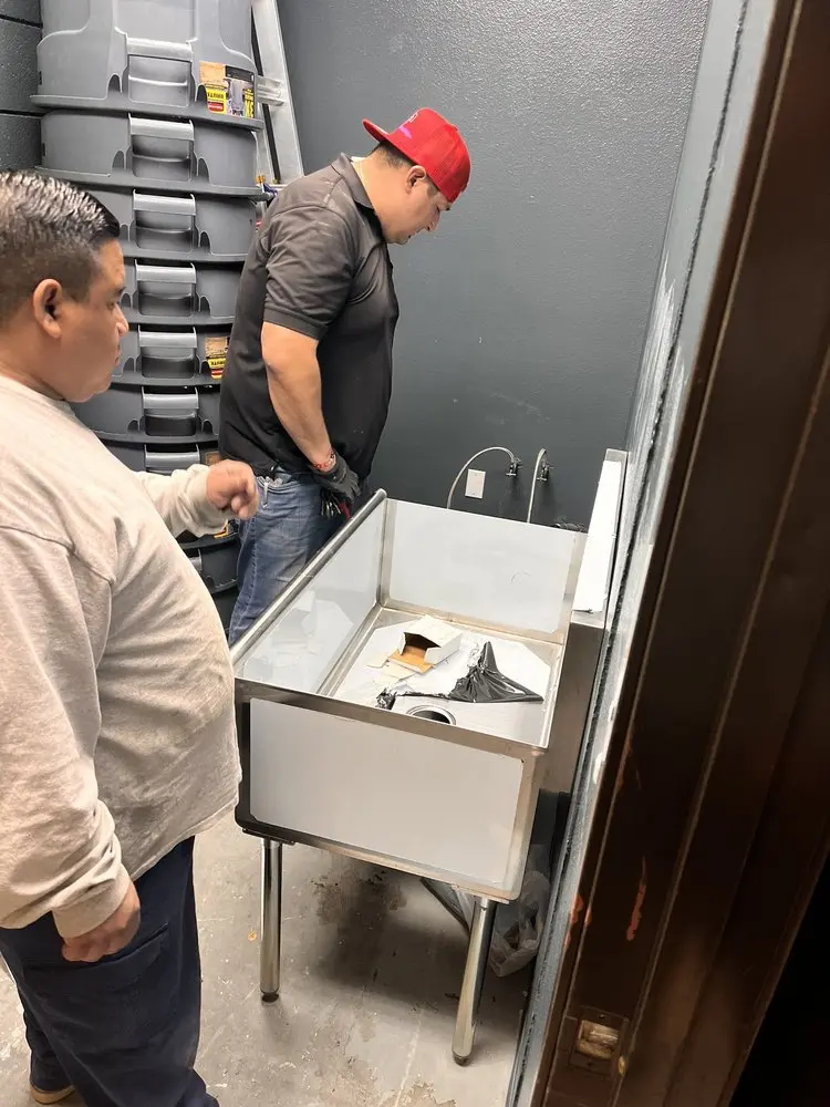 Commercial plumbing and sink installation in Logan